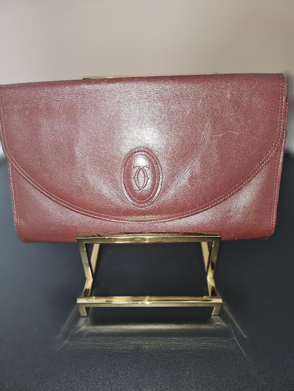 Cartier Wine Red Leather Clutch with Gold Accent
